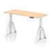 This picture shows a sleek and modern dynamic sit stand desk, measuring 1400 x 600mm, with a maple top and white leg. The desk is height adjustable and includes cable ports and a piste foot for stability.