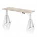 This image features a sleek grey oak top office desk with a white leg and piste foot, designed with cable ports for practicality. The desk is 1600 x 600mm and can be easily adjusted for sitting or standing positions, promoting a dynamic and ergonomic work environment.