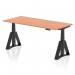 The photo shows a sleek and modern office desk with a beech wood top and black legs. The desk is 1800 x 800mm in size and features a dynamic sit-stand function, as well as height adjustable capabilities. The design also includes a Piste Foot for added stability.