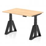 The photograph shows a sleek and modern Dynamic Sit Stand and Height Adjustable Desk. The desk features a 1200 x 800mm Maple top with a Black leg and Piste Foot. The adjustable design allows for comfortable sitting or standing while working.