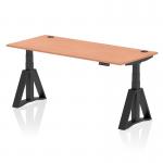 The photo features a dynamic Sit Stand and Height Adjustable Desk, with an Air 1800 x 800mm Beech Top. The desk has convenient Cable Ports and a classic Black Leg with a Piste Foot. Its unique design is perfect for any contemporary office space.