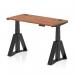 This photograph captures a sleek and modern dynamic sit stand desk. The walnut top and black legs give it a professional look, while the adjustable height and cable ports make it functional for any office space. The piste foot adds a touch of style and stability to this 1200 x 600mm desk.