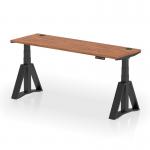 This photo captures a sleek, modern office desk with a walnut top and black leg. The desk is adjustable in height and features cable ports and a unique piste foot design. Its a perfect blend of style and functionality for any dynamic workspace.