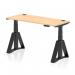 This picture showcases a modern and versatile workplace solution with a dynamic sit stand and height adjustable desk measuring 1400 x 600mm. The desk features a maple top and black leg with piste foot, as well as cable ports for better organization.