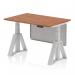 The photo shows a modern and versatile workspace with a dynamic sit-stand and height adjustable desk. The desk has a walnut top and silver legs, as well as a silver steel modesty panel and piste foot. This desk offers flexibility and functionality in any office setting.