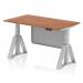 This picture features a sleek and modern 1400 x 800mm height adjustable office desk with a walnut top and silver leg. The desk also has a silver steel modesty panel and piste foot for added stability. The dynamic sit stand and height adjustable design allows for versatility in any office space.