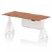 The photo shows a modern and versatile office desk that can be easily adjusted to accommodate both sitting and standing positions. The sleek walnut top has a white steel modesty panel attached, and the white legs feature a unique piste foot design. Ideal for any professional workspace.