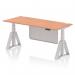 This photo features a sleek, modern desk with an adjustable height and cable ports for an organized workspace. The beech top pairs nicely with the silver leg and modesty panel, giving off a professional vibe. The piste foot adds a touch of functionality.