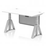This picture features a white top height adjustable office desk with cable ports and a silver leg. The desk also has a silver steel modesty panel and a piste foot for added support. Perfect for creating a dynamic and comfortable workstation.