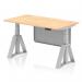 This picture depicts a sleek 1400 x 800mm height adjustable office desk with a maple top and silver leg. It also features a silver steel modesty panel, cable ports, and a piste foot for added stability. The desk is versatile, allowing you to switch between sitting and standing positions throughout the day.