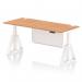 This photo features a sleek and modern Dynamic Sit Stand and Height Adjustable Desk. The desk has an airy Oak top with cable ports, supported by white steel legs which also includes a white modesty panel and piste foot. The desk has a generous size of 1800 x 800mm, making it perfect for any office space.