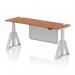 The photo shows a modern office desk that is 1800mm x 600mm in size. It has a sleek walnut top and silver legs with a matching steel modesty panel. The desk is height adjustable and features cable ports for organization. A piste foot adds a stylish touch to this dynamic sit stand desk.