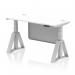The picture shows a sleek, modern office desk with a white top and silver legs. The desk is equipped with cable ports for organization and a steel modesty panel for privacy. The height can be adjusted for comfortable sitting or standing, and there is a piste foot for added support.