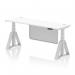 This photo features a sleek white top desk with silver legs and a matching steel modesty panel. The desk is 1800 x 600mm and equipped with cable ports. The height is adjustable and it also has a piste foot for dynamic sitting and standing options.