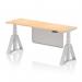 The photo shows a sleek and modern 1800 x 600mm office desk with a maple top and silver legs. It features a dynamic sit stand and height adjustable design, along with built-in cable ports for organization. The desk also includes a silver steel modesty panel and piste foot for added stability.
