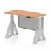 This photograph showcases a modern and versatile office desk. Its width of 1200mm and depth of 600mm make it great for various workspaces. The oak top gives it a sleek and natural look, while the silver leg and steel modesty panel add a touch of sophistication. Equipped with cable ports and a piste foot for easy adjustments, this desk is perfect for any task at hand.