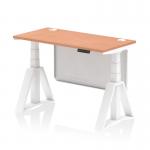 The photograph captures a modern and flexible workspace with a sleek height adjustable desk. The desk features a beech top with contrasting white legs and a steel modesty panel. Cable ports and a piste foot add practicality and style to this dynamic sit stand desk.
