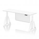 The photo shows a sleek, modern office desk with a white top and white steel modesty panel. The desk also features cable ports and a piste foot for stability. Its 1800 x 600mm size and height adjustability make it a versatile and ergonomic choice for any workspace.