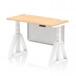 The photograph features a sleek and modern Dynamic Sit Stand and Height Adjustable Desk. The desk is 1200 x 600mm and boasts a stylish maple top with convenient cable ports. The white leg and sturdy steel modesty panel add a touch of elegance, while the Piste Foot ensures stability for a comfortable work experience.