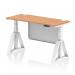 This picture features a sleek and modern desk with a oak top and white steel legs. The desk is 1400 x 600mm in size and has cable ports for easy organization. The desk is also height adjustable, with a dynamic sit stand feature for improved comfort. The white steel modesty panel adds a touch of elegance, and the piste foot adds stability.