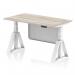 The photo shows a sleek grey oak top office desk with a white height adjustable leg, complete with a white steel modesty panel and piste foot. This dynamic sit stand desk allows for comfortable and customizable work positions. Modern and practical for any workspace.