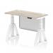 The photograph shows a sleek and modern office desk with a grey oak top and white steel frame. It also features height adjustability, cable ports, and a white steel modesty panel. The unique piste foot design adds a touch of style and functionality. Perfect for a dynamic and ergonomic workspace.