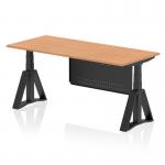 This photo showcases a sleek and modern office desk with a spacious 1800 x 800mm oak top and black steel legs. The desk is equipped with dynamic sit-stand and height adjustment capabilities, along with a piste foot for added support. A black steel modesty panel adds a touch of privacy and sophistication to the design.