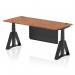 This photo shows a sleek and modern dynamic sit stand and height adjustable desk. It features a walnut top with cable ports and a black steel modesty panel. The desk is 1800 x 800mm and has adjustable legs with a black piste foot.