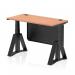 This photograph showcases a dynamic sit stand and height adjustable desk with a beech top and black leg. The desk also features cable ports and a black steel modesty panel, along with a piste foot for added stability. The desk measures 1200 x 600mm and is the perfect addition to any office space.