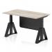 The picture shows a gray oak top with a black steel modesty panel on a dynamic sit stand and height adjustable desk. The desk measures 1400 x 800mm and has black legs with a piste foot for stability. It is suitable for use in offices and can be adjusted to different heights for comfort while working.