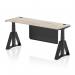 This photo features a sleek and modern office desk, measuring 1800 x 600mm, with a grey oak top and black leg. It is equipped with height adjustable capabilities and cable ports for convenience. The black steel modesty panel and piste foot add a stylish touch.