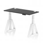 The dynamic sit stand and height adjustable desks have a sleek black top with cable ports and white legs. The piste foot adds a modern touch to the 1200 x 600mm desk. Perfect for any office setting, this desk offers versatility and style.