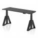 The image shows a modern black desk with adjustable height and a sleek black surface. It features cable ports for easy organization and a unique piste foot design on the legs. This versatile desk is perfect for any office space.