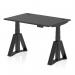 A photo of the Dynamic Sit Stand and Height Adjustable Desks Air showcases a sleek black top, cable ports, and legs with a piste foot. The desk measures 1200 x 800mm and can be easily adjusted to accommodate various heights, making it versatile and practical for any office setting.
