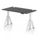 This picture shows a dynamic sit-stand and height-adjustable desk with dimensions of 1400 x 800mm. The desk features a black top and white legs, and comes with cable ports and a piste foot. The desk is perfect for any office setting.