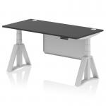 The photo captures a modern office desk, measuring 1600 x 800mm and featuring a sleek black top and silver leg. It is equipped with cable ports and a steel modesty panel, and the adjustable height and sit-stand function make it suitable for any workplace. The piste foot adds a stylish touch to the overall design.