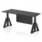 The picture shows a modern, stylish sit stand and height adjustable office desk. The desk has a sleek black top with integrated cable ports, supported by sturdy black legs and a matching steel modesty panel. The added feature of a piste foot adds to the desks dynamic design.