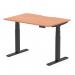 The photograph shows a sleek and modern office desk with a scalloped edge, made of beech wood with a black adjustable leg. The desk is 1200 x 800mm in size and can be easily adjusted for both sitting and standing positions. Its dynamic design makes it ideal for any work environment.