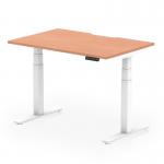 This image shows a modern office desk with a scalloped edge design. It features a 1200 x 800mm beech top and white adjustable legs. The desk is both sit-stand and height adjustable, allowing for a dynamic and versatile workspace.