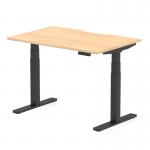 The image showcases a spacious 1200 x 800mm maple top with a scalloped edge on a black leg desk. The desk is equipped with dynamic sit stand and height adjustable features, perfect for any office setting. The sleek design adds a touch of modernity to the workspace.