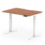 The image shows a sleek and modern dynamic sit-stand desk with a scalloped edge, measuring 1200 x 800mm. The desk has a walnut top and a white leg, giving it a professional and stylish look. This desk is also height-adjustable, making it versatile for any type of work.