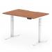 The image shows a sleek and modern dynamic sit-stand desk with a scalloped edge, measuring 1200 x 800mm. The desk has a walnut top and a white leg, giving it a professional and stylish look. This desk is also height-adjustable, making it versatile for any type of work.