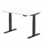 This photo features a sleek and modern dynamic sit stand desk with a scalloped edge white top and black legs. The desk is 1200 x 800mm in size and is height adjustable, allowing for customizable and ergonomic work setup.