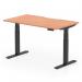 This image shows a Dynamic Sit Stand and Height Adjustable Desk, featuring a scalloped edge and a beech top with black legs. The desk measures 1400 x 800mm and is designed for use in an office environment. Its adjustable height allows for comfortable sitting or standing positions.