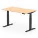 The photograph shows a sleek and modern office desk with a dynamic sit stand feature, with a scalloped edge and a maple top. It is supported by black adjustable legs and has a spacious work surface of 1400 x 800mm. The design promotes a versatile and ergonomic work environment.