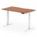 This photograph features a sleek and modern Dynamic Sit Stand and Height Adjustable Desk. The desk measures 1400 x 800mm and has a scalloped edge, with a walnut top and white legs. The desk can be easily adjusted to fit any height preference.