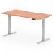 This picture shows a modern and versatile office desk with a scalloped edge, measuring 1600 x 800mm. Its sleek design features an adjustable height system and standing functionality, making it perfect for a dynamic and ergonomic workspace. The light beech top and silver leg add a touch of elegance to any office setting.