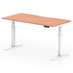 The image shows a modern dynamic sit-stand desk with a scalloped edge, measuring 1600 x 800mm. Its beech top is supported by sleek white legs. The desk is height adjustable, making it versatile and suitable for any office setting.