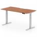 This picture features a sleek and modern Dynamic Sit Stand and Height Adjustable Desk, measuring 1600 x 800mm with a scalloped edge design. The desk has a stylish Walnut top and a silver leg, creating a professional and functional addition to any office space.