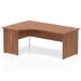 The picture depicts a sleek, modern office space with a large Impulse 1800mm Left Crescent Office Desk. The desk features a walnut top panel and end leg, adding a touch of natural warmth to the otherwise contemporary design. The dynamic corner configuration is perfect for maximizing space and promoting efficiency.